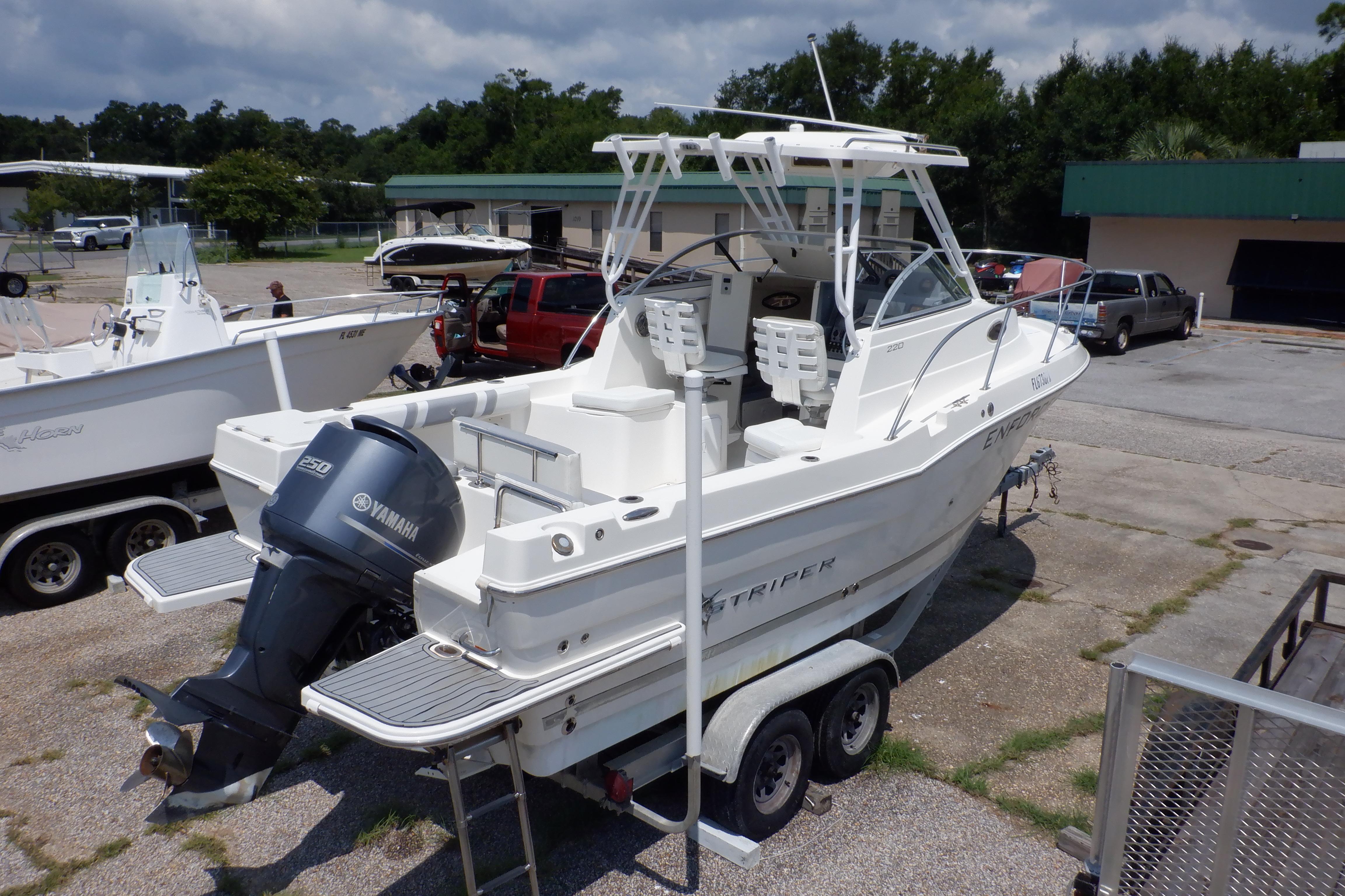 2015 Seaswirl Striper 220 Walkaround boat on trailer with Yamaha outboard motor.