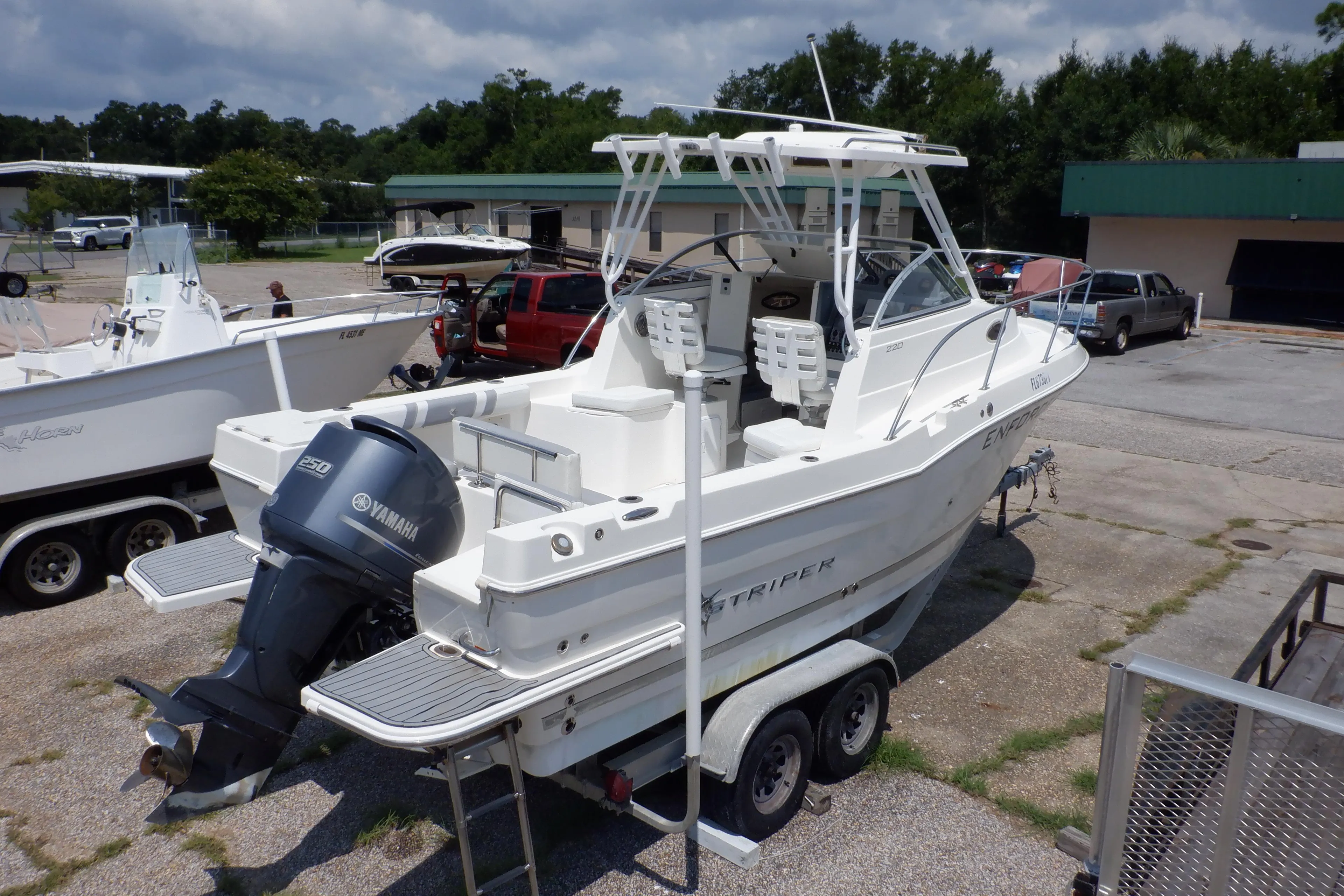 2015 Seaswirl Striper 220 Walkaround boat on trailer with Yamaha outboard motor.