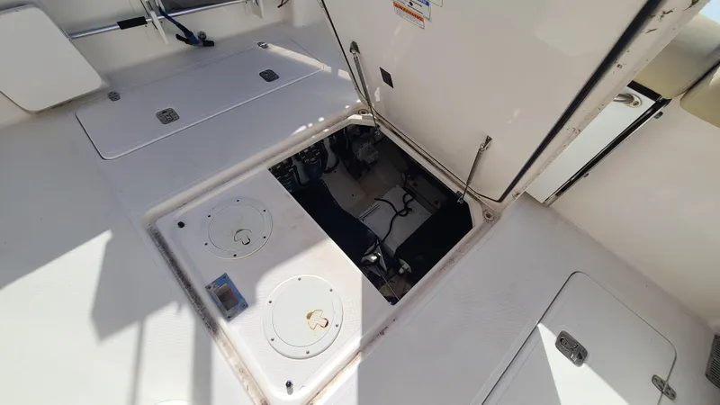  Yacht Photos Pics 2016 Pursuit DC 325 Dual Console boat with open engine compartment.