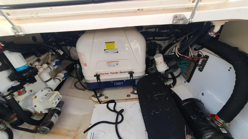  Yacht Photos Pics Engine compartment of 2016 Pursuit DC 325 Dual Console boat, showcasing mechanical components.