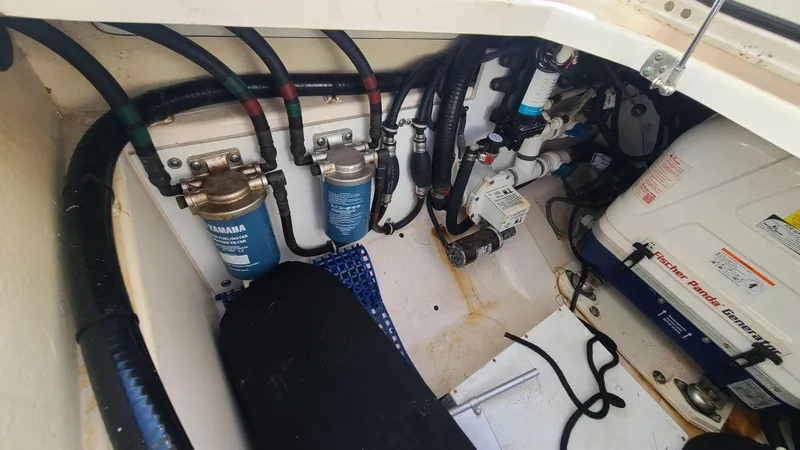  Yacht Photos Pics Engine compartment of a 2016 Pursuit DC 325 Dual Console boat, showing filters and wiring.