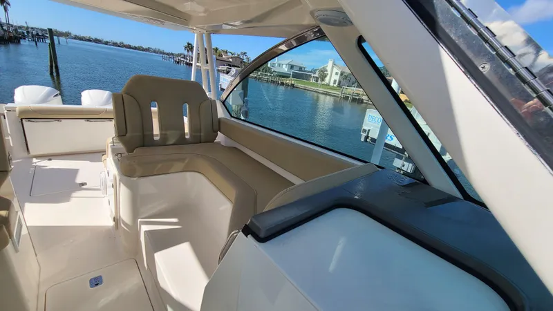  Yacht Photos Pics 2016 Pursuit DC 325 Dual Console boat interior with waterfront view.