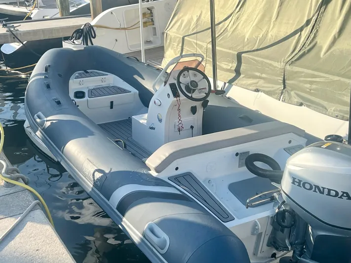  Yacht Photos Pics Inflatable boat with Honda motor, docked beside Lagoon 620, 2017 model.