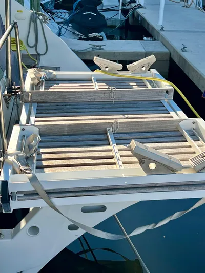  Yacht Photos Pics Lagoon 620 yacht boarding platform, 2017 model, docked at marina.