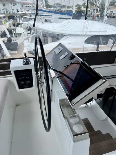  Yacht Photos Pics Helm of 2017 Lagoon 620 yacht with steering wheel and navigation controls.