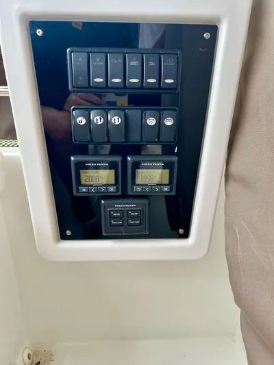  Yacht Photos Pics Control panel of a 2017 Lagoon 620 yacht with switches and digital displays.