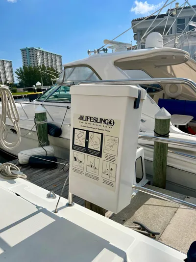  Yacht Photos Pics Lifesling3 on Lagoon 620 yacht, docked with other boats, sunny day, 2017 model.