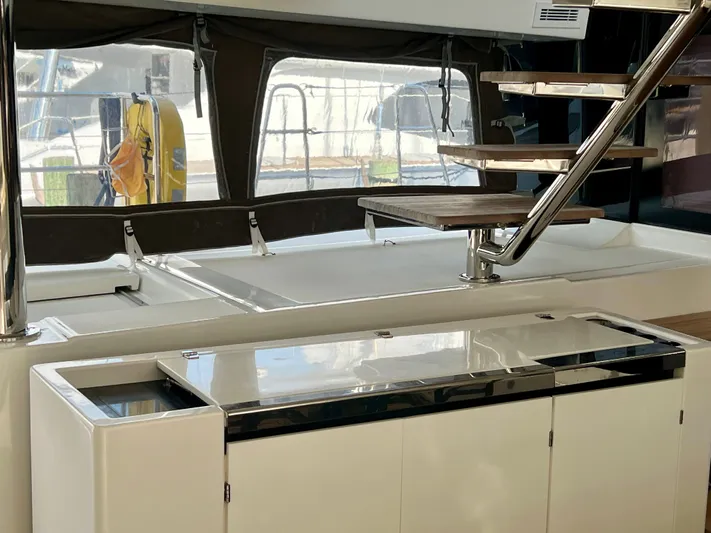  Yacht Photos Pics Interior of 2017 Lagoon 620 yacht with modern staircase and sleek cabinetry.