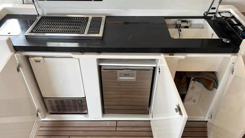  Yacht Photos Pics Outdoor kitchen on 2017 Lagoon 620 yacht with grill, sink, and storage cabinets.