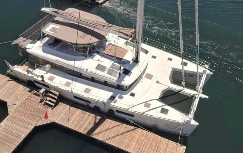  Yacht Photos Pics 2017 Lagoon 620 catamaran docked at marina, aerial view.