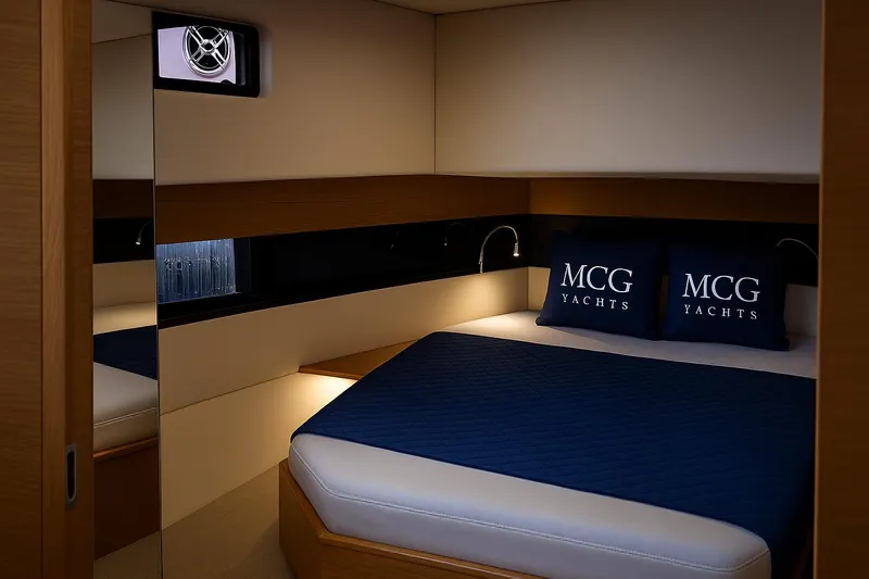  Yacht Photos Pics Luxurious cabin interior of 2021 De Antonio Yachts D42 with elegant bedding.