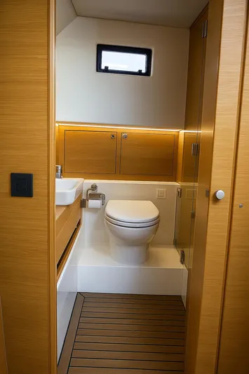  Yacht Photos Pics Luxurious bathroom interior of 2021 De Antonio Yachts D42 with modern fixtures and wooden accents.