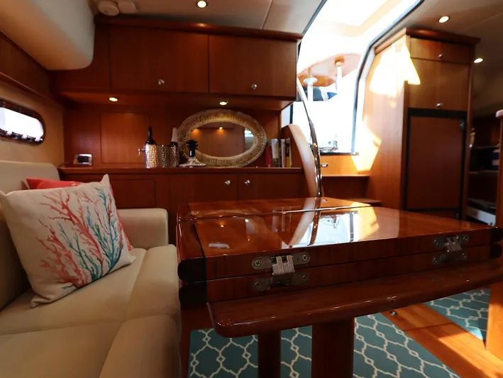 Ocho Yacht Photos Pics Luxurious interior of 2009 Tiara Yachts 4300 Sovran with elegant wood finishes.