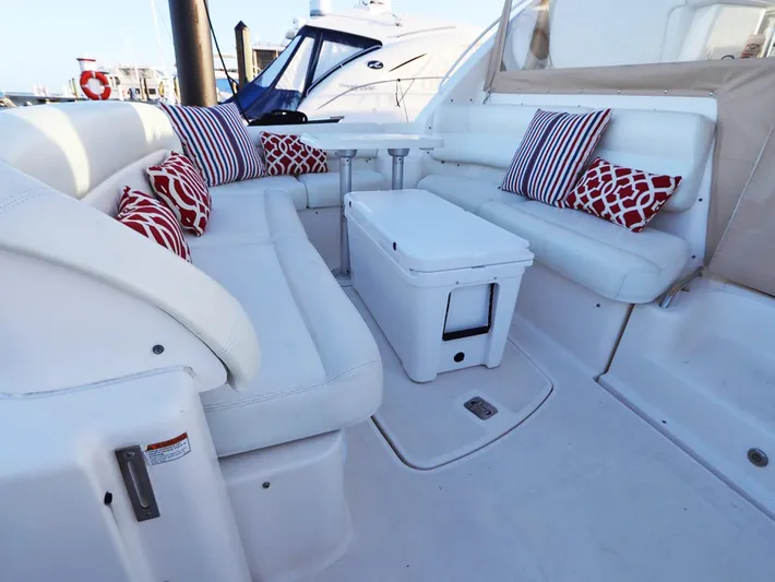 Ocho Yacht Photos Pics 2009 Tiara Yachts 4300 Sovran interior with white seating and colorful cushions.