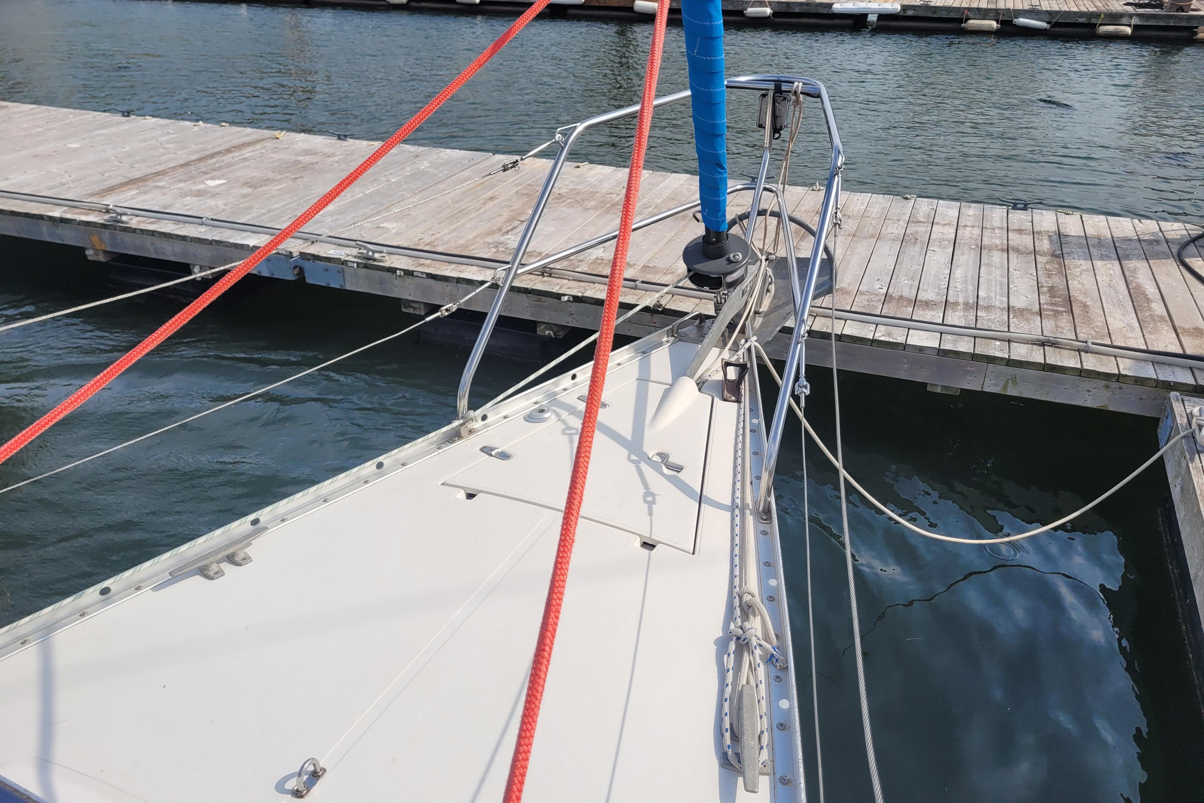 1987 CS 30 sailboat docked, featuring deck and rigging details.