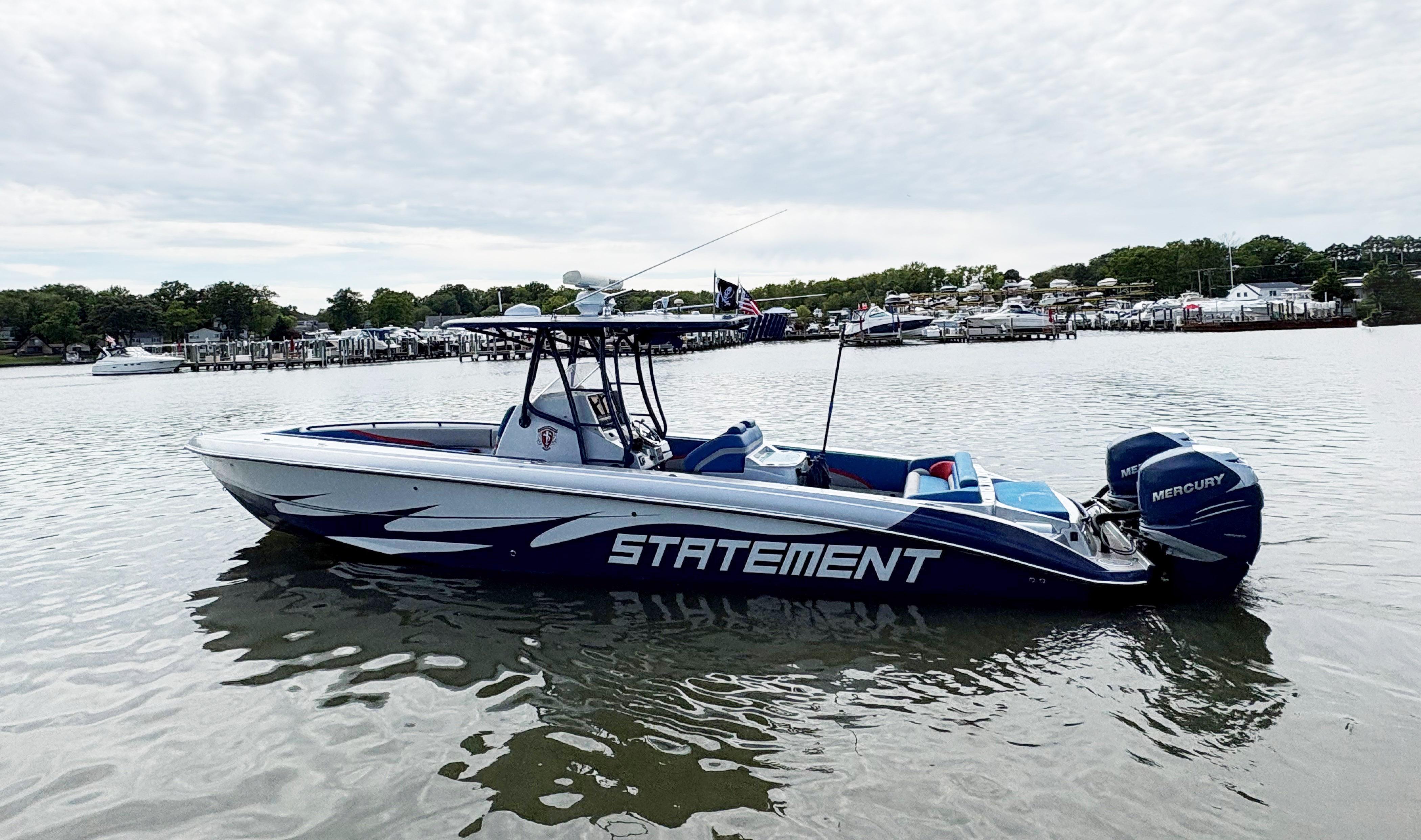 2011 Statement 380 Open boat on calm water, featuring sleek design and Mercury engines.