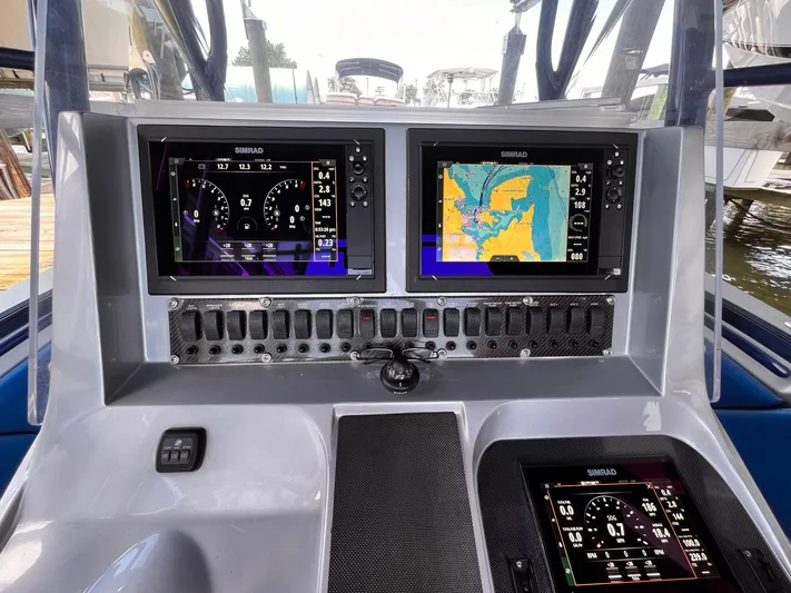  Yacht Photos Pics Dashboard of 2011 Statement 380 Open boat with navigation screens and controls.