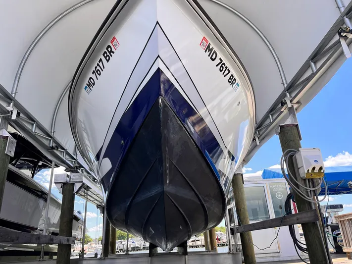 Yacht Photos Pics 2011 Statement 380 Open boat docked, viewed from below, showcasing sleek hull design.