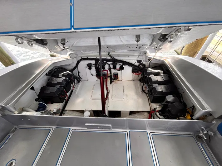  Yacht Photos Pics Engine compartment of a 2011 Statement 380 Open boat, showcasing battery setup and wiring.