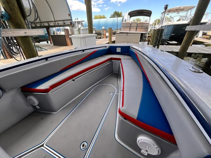  Yacht Photos Pics Interior of a 2011 Statement 380 Open boat with red and blue seating.