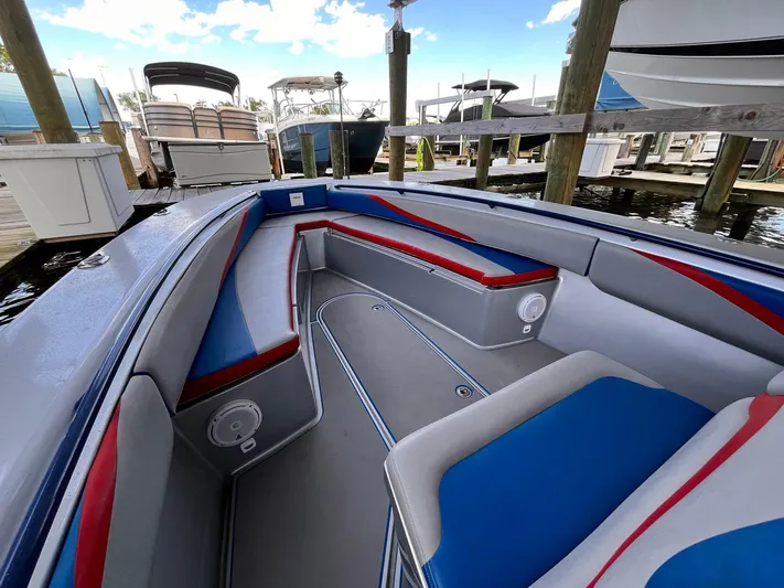  Yacht Photos Pics Interior of a 2011 Statement 380 Open boat with blue and red seating.