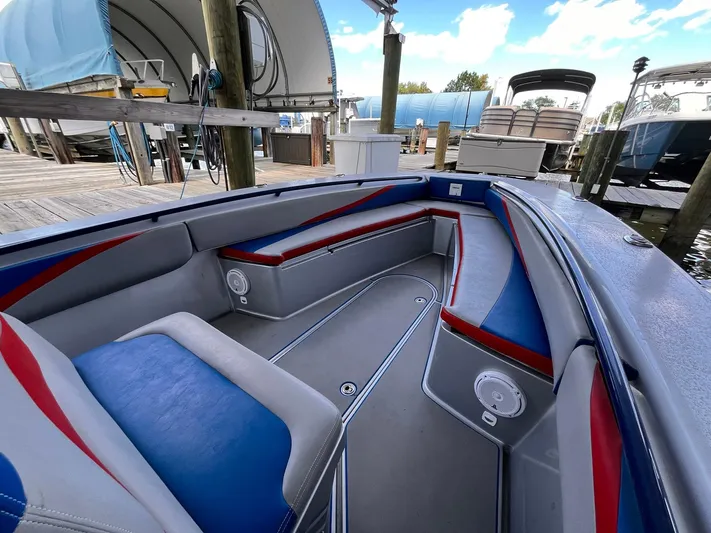  Yacht Photos Pics Interior of a 2011 Statement 380 Open boat with blue and red seating.