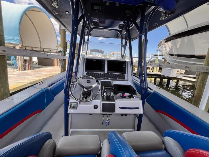  Yacht Photos Pics Interior view of 2011 Statement 380 Open boat with steering wheel and controls.