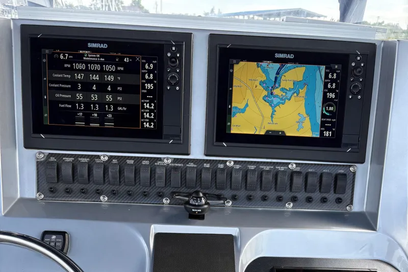  Yacht Photos Pics Dashboard of a 2011 Statement 380 Open boat with dual Simrad displays.