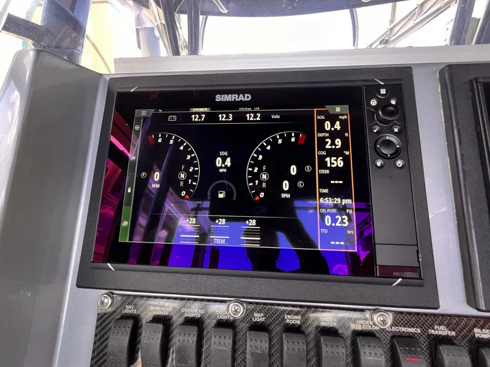  Yacht Photos Pics Simrad marine display on 2011 Statement 380 Open boat dashboard showing navigation data.