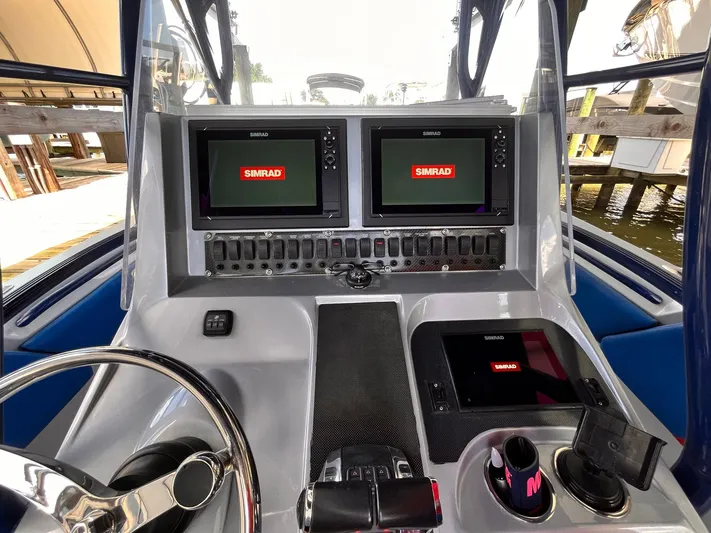  Yacht Photos Pics Control panel of a 2011 Statement 380 Open boat with Simrad displays.