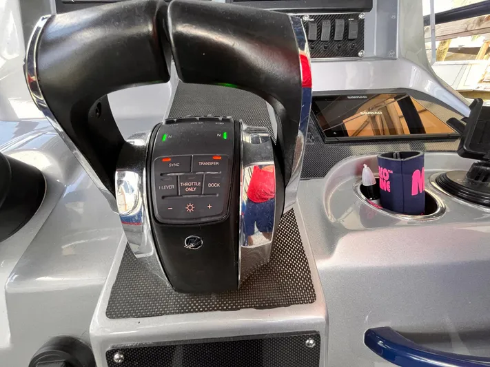  Yacht Photos Pics Control panel of a 2011 Statement 380 Open boat with throttle and display.