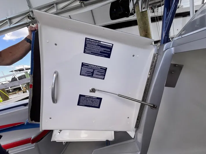  Yacht Photos Pics Open storage compartment on 2011 Statement 380 Open boat with visible safety instructions.