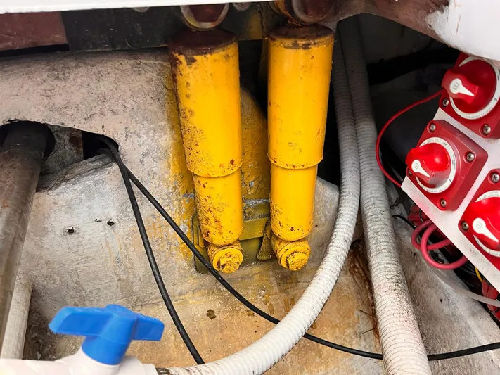  Yacht Photos Pics Yellow hydraulic cylinders in a 2011 Statement 380 Open boat engine compartment.