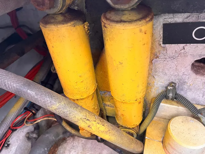  Yacht Photos Pics Yellow hydraulic cylinders in a 2011 Statement 380 Open boat engine compartment.