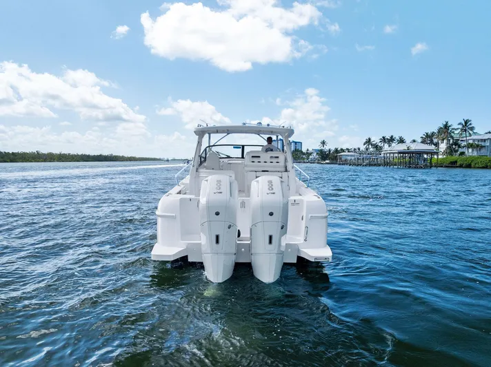 Tide Chaser Yacht Photos Pics 2022 Intrepid 438 Evolution boat cruising on a sunny day.