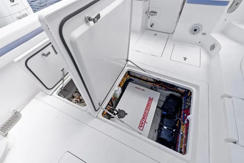 Tide Chaser Yacht Photos Pics Open hatch on 2022 Intrepid 438 Evolution boat showing engine compartment.