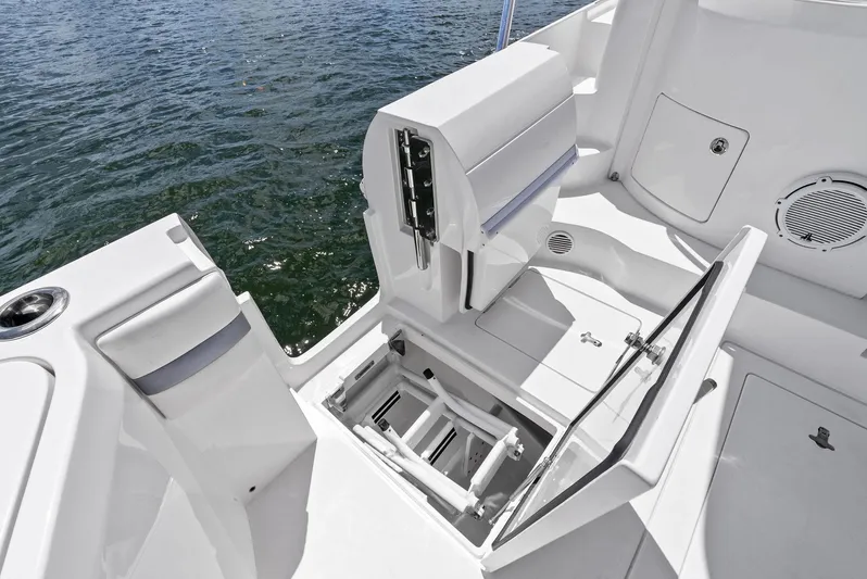 Tide Chaser Yacht Photos Pics 2022 Intrepid 438 Evolution boat deck with open storage compartment.