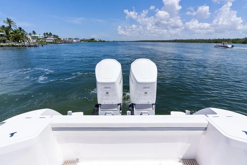 Tide Chaser Yacht Photos Pics 2022 Intrepid 438 Evolution boat with dual engines on a sunny day.
