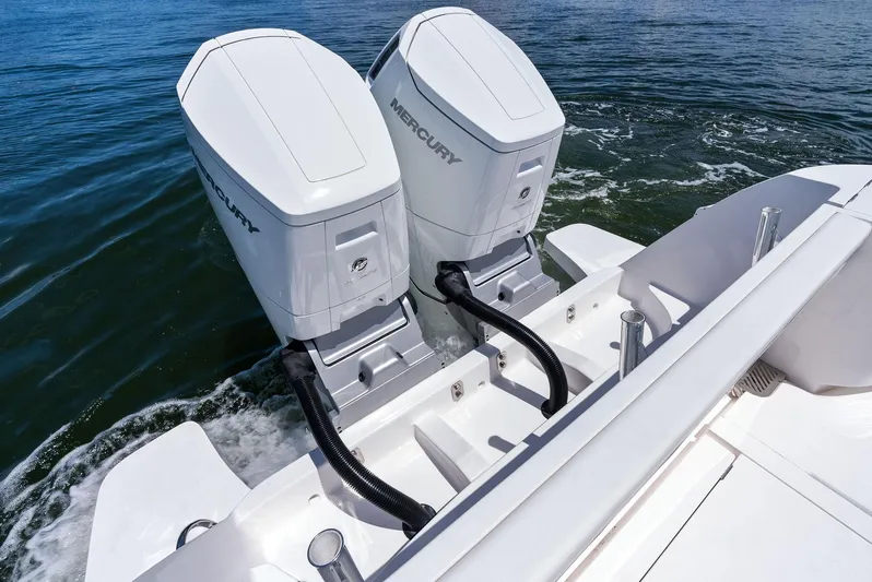 Tide Chaser Yacht Photos Pics 2022 Intrepid 438 Evolution boat with dual Mercury outboard engines on water.