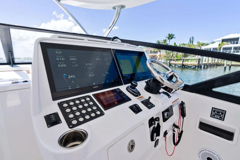 Tide Chaser Yacht Photos Pics 2022 Intrepid 438 Evolution helm with advanced navigation displays and controls.