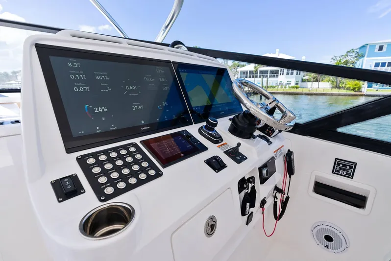 Tide Chaser Yacht Photos Pics 2022 Intrepid 438 Evolution helm with advanced navigation displays and controls.