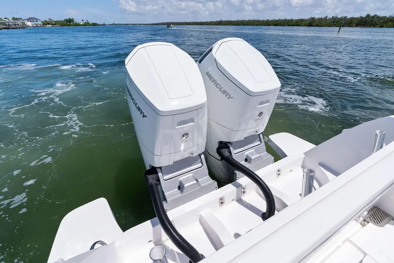 Tide Chaser Yacht Photos Pics Twin Mercury outboard engines on a 2022 Intrepid 438 Evolution boat in open water.