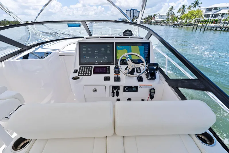 Tide Chaser Yacht Photos Pics Helm of 2022 Intrepid 438 Evolution yacht with advanced navigation system and luxurious seating.