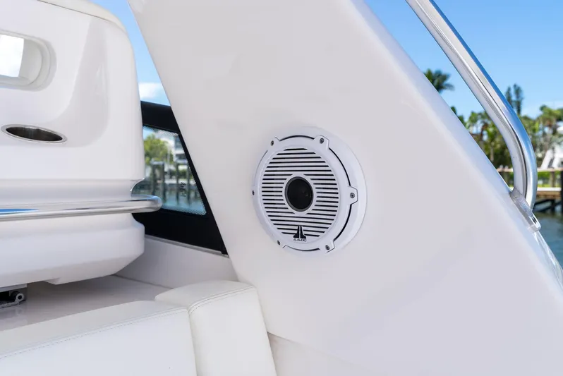 Tide Chaser Yacht Photos Pics 2022 Intrepid 438 Evolution boat interior with speaker and railing detail.