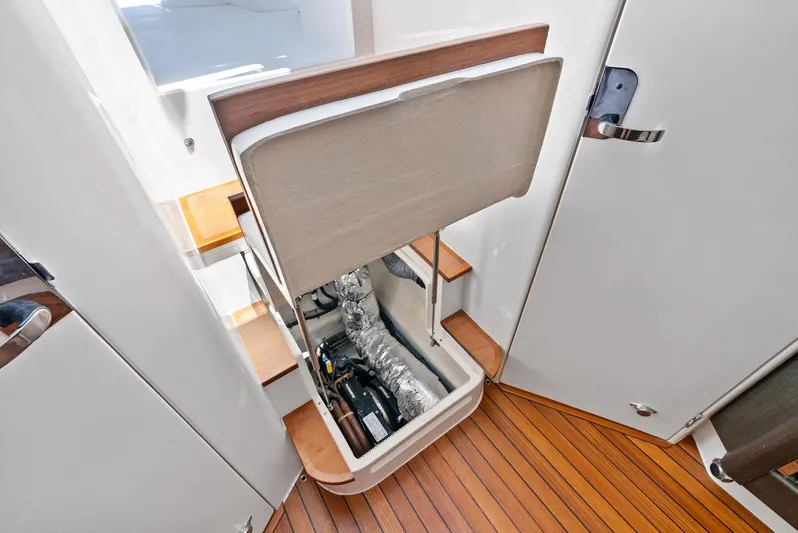Tide Chaser Yacht Photos Pics 2022 Intrepid 438 Evolution yacht interior with open engine compartment.