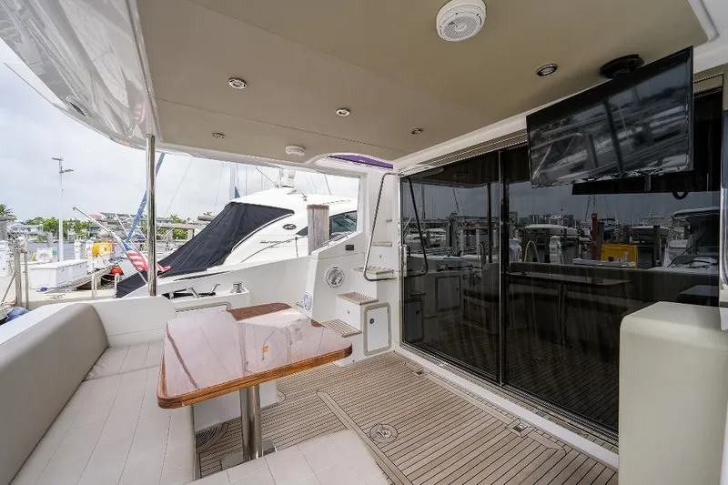 Vivere Yacht Photos Pics Luxurious 2016 Azimut 50 yacht deck with seating, table, and marina view.