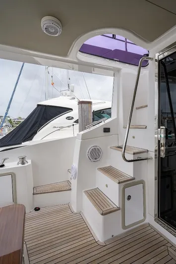 Vivere Yacht Photos Pics 2016 Azimut 50 yacht interior with wooden steps and modern design elements.