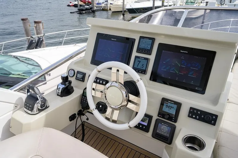 Vivere Yacht Photos Pics Helm of 2016 Azimut 50 yacht with modern navigation displays and controls.