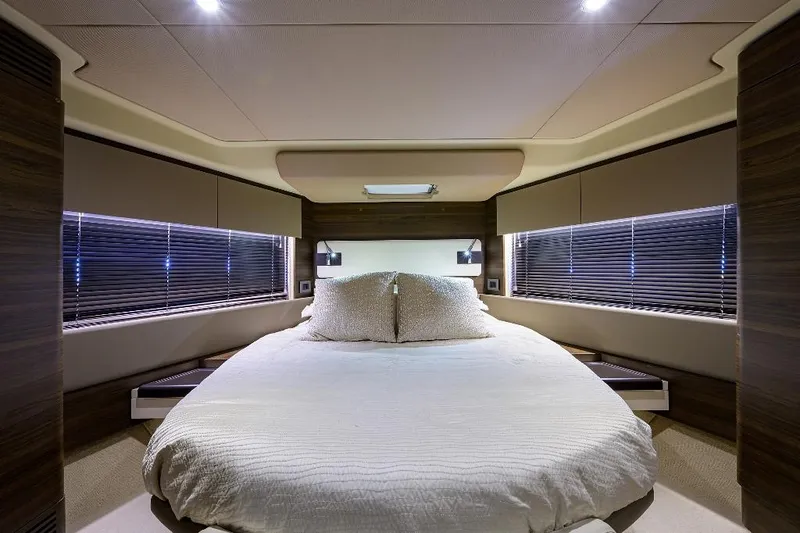 Vivere Yacht Photos Pics Luxurious bedroom interior of 2016 Azimut 50 yacht with modern design and ambient lighting.