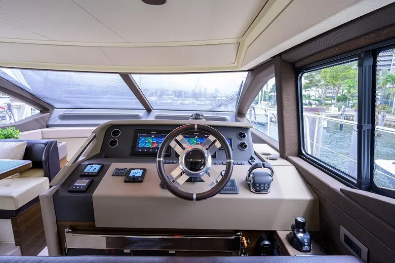 Vivere Yacht Photos Pics 2016 Azimut 50 yacht helm with modern navigation controls and panoramic windows.